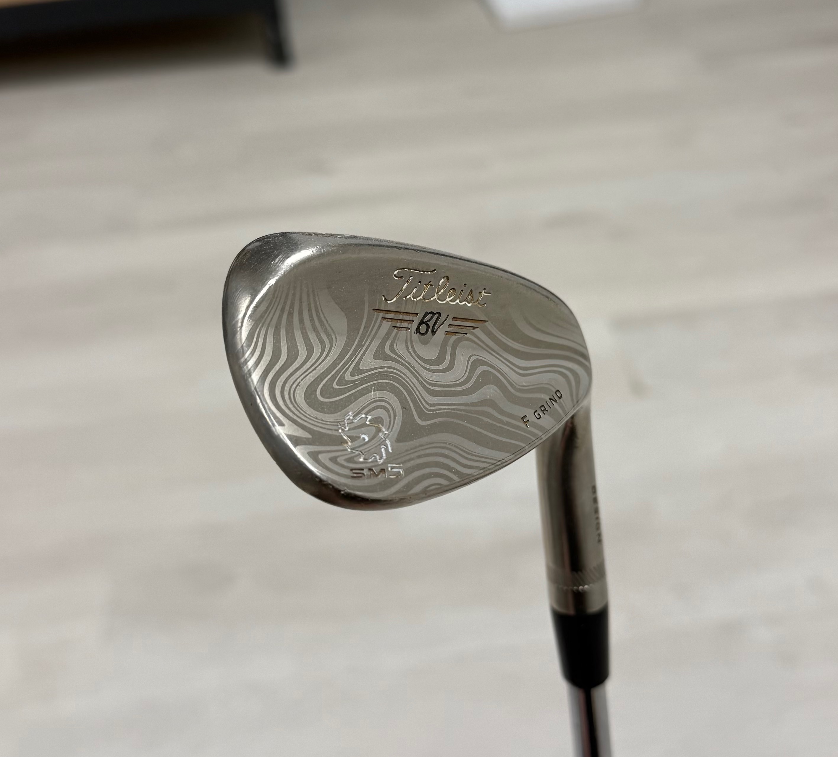 Titleist SM5 wedge with topographic wave pattern engraving